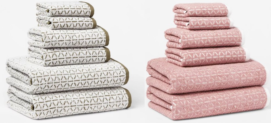 white and pink stacks of bath towels