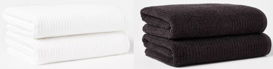 white and black stacks of bath towels