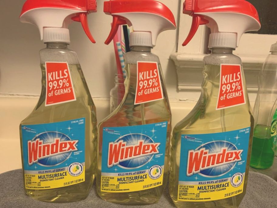 3 bottles of Windex Multi-surface cleaner on a counter