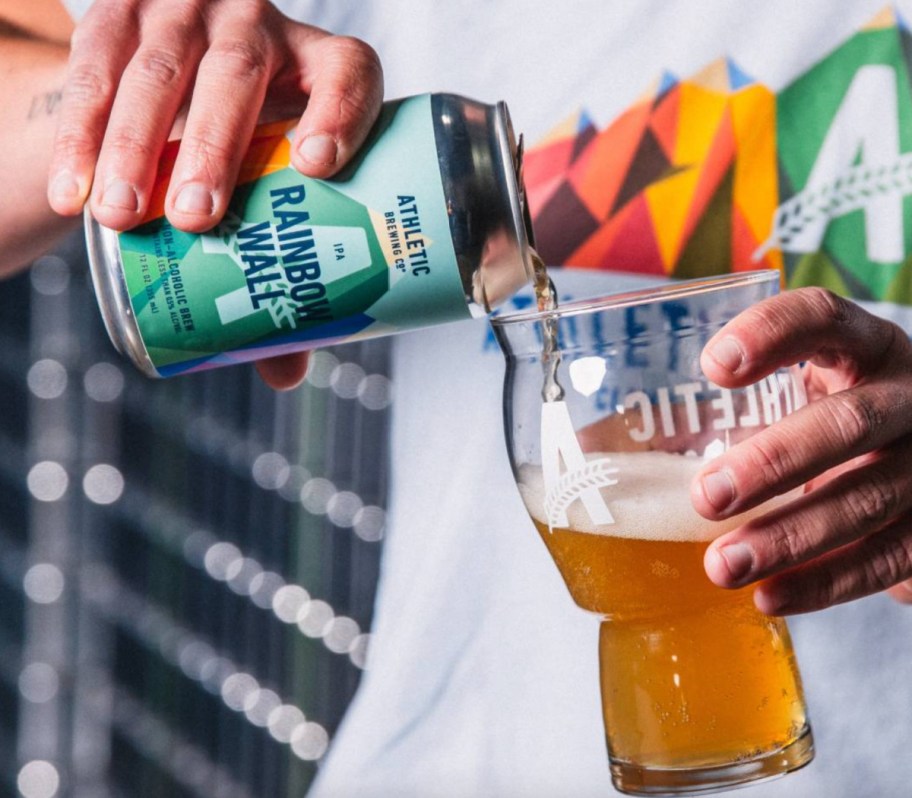 pouring non alcoholic beer in glass