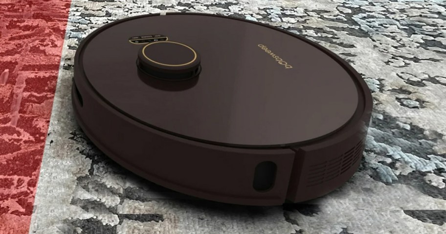 black robot vacuum on gray carpet