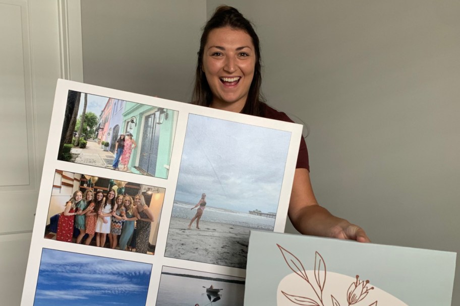 woman holding two canvases