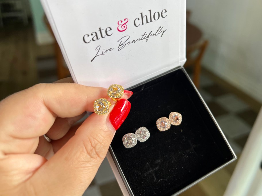 three pairs of stud earrings in box