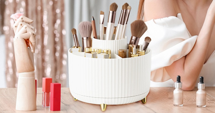 white makeup organizer with brushes on table