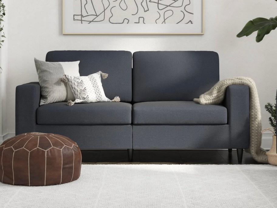 blue 3 seat sofa in living room 