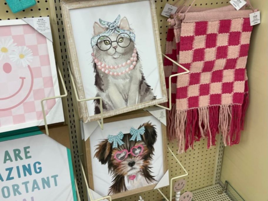 fancy dog and cat wall art hanging in store