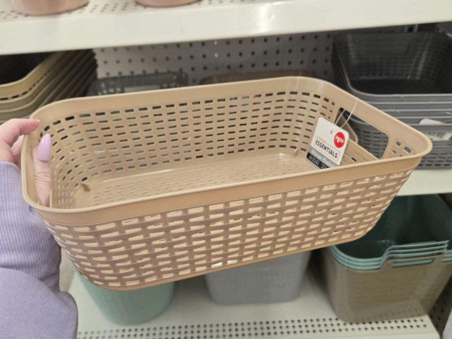 Essentials Rectangular Slotted Plastic Basket in hand in store