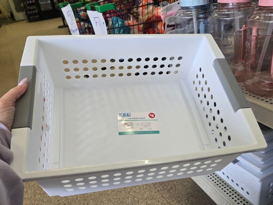 Large Stackable White Plastic Basket in hand in store