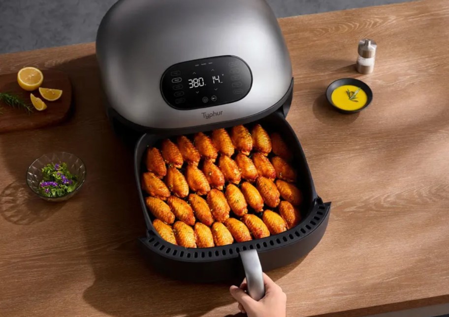 typhur dome air fryer with wings inside of it