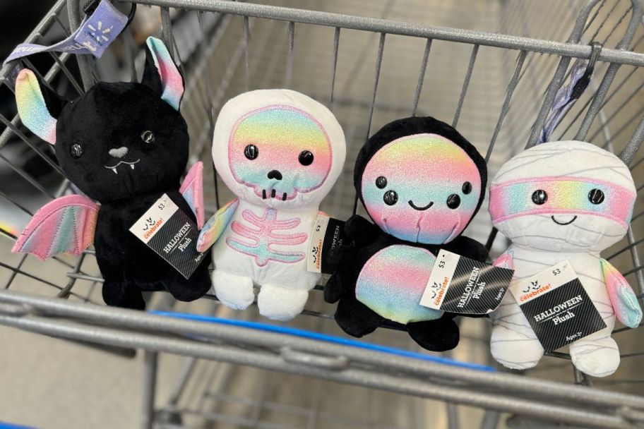 4 halloween plush dolls in a shopping cart