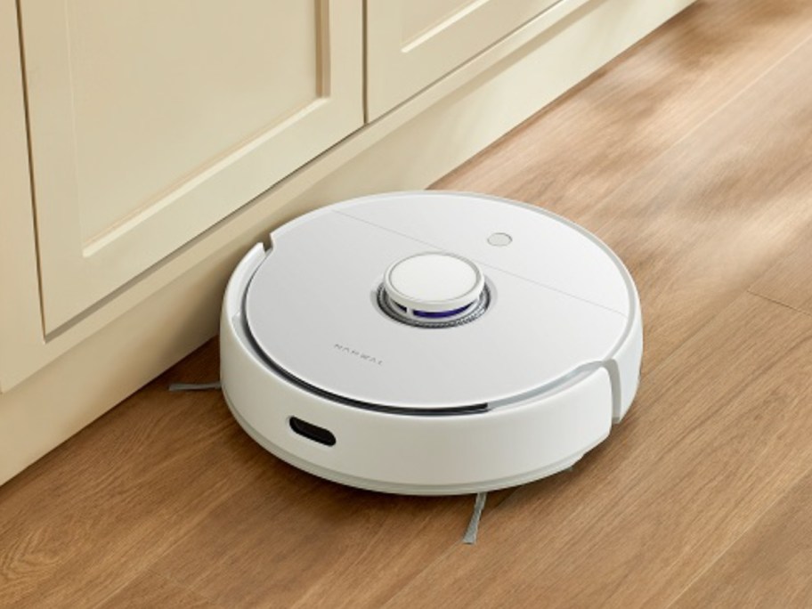 white robovac on wood floor