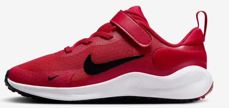 red and black Nike Revolution 7 Little Kids' Shoe stock image