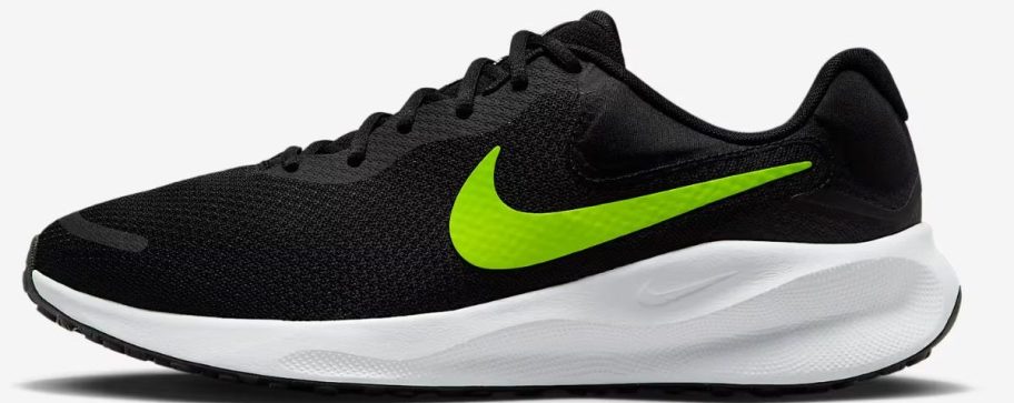 black and green Nike Revolution 7 Men's Road Running Shoe stock image