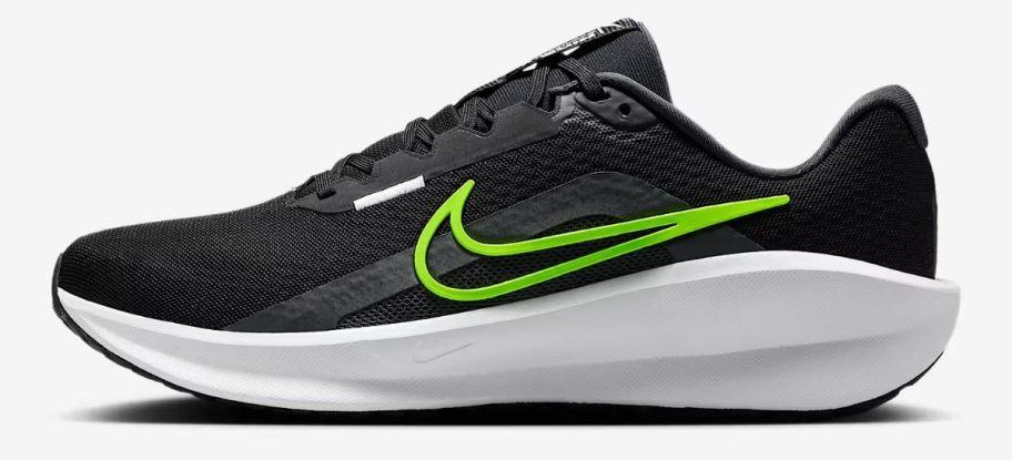 black and green Nike Downshifter 13 Men's Road Running Shoe stock image