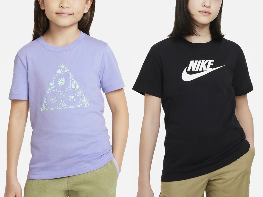 two girls wearing purple and black tees