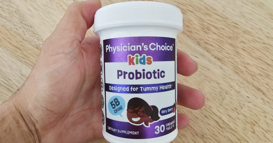 hand holding physcians choice kids probiotic bottle 