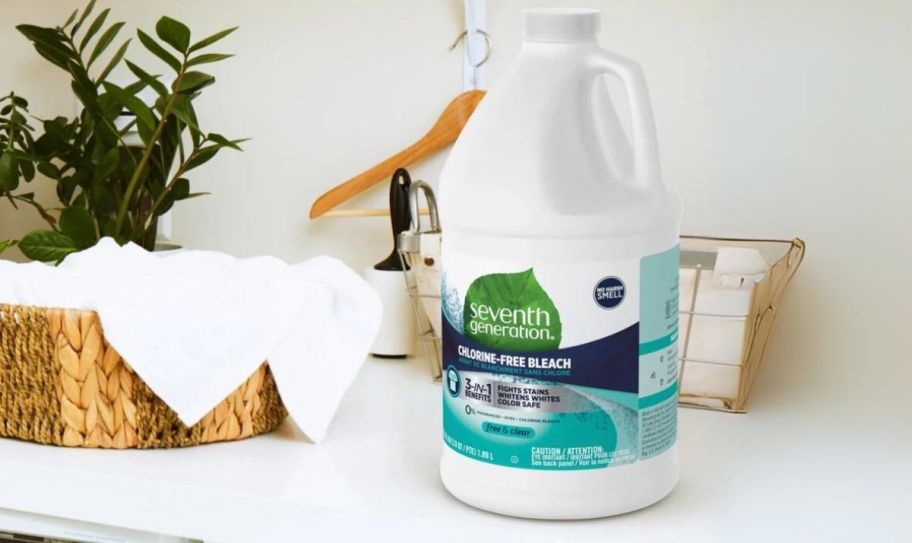 a 64 ounce jug of seventh generation chlorine free bleach on a counter in a laundry room