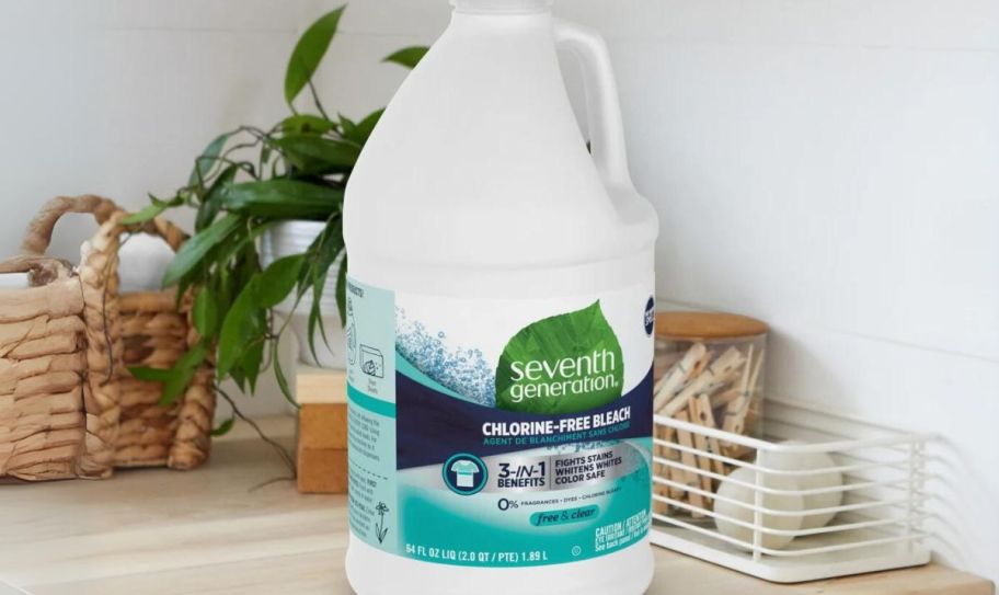 a 64 ounce jug of seventh generation chlorine free bleach on a counter in a laundry room