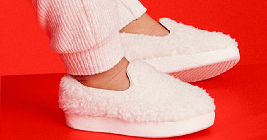 white slip on allbirds shoes on childs feet 