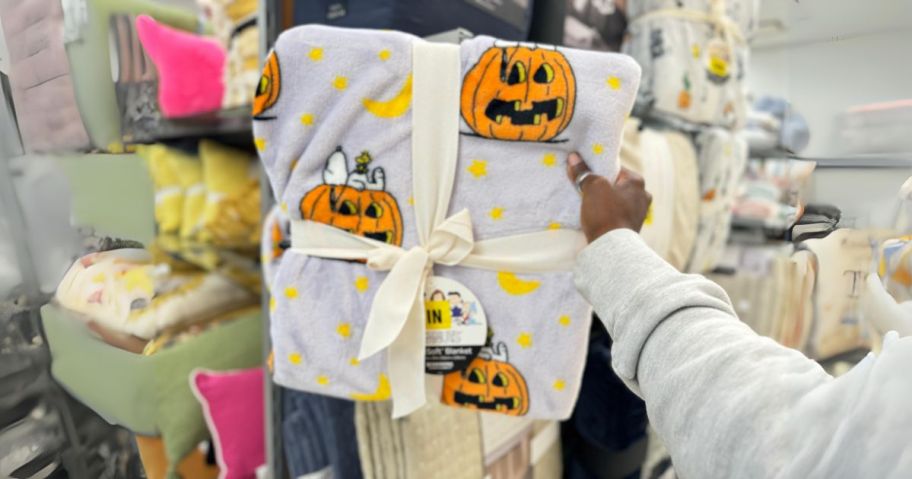 halloween peanuts blanket in hand in store