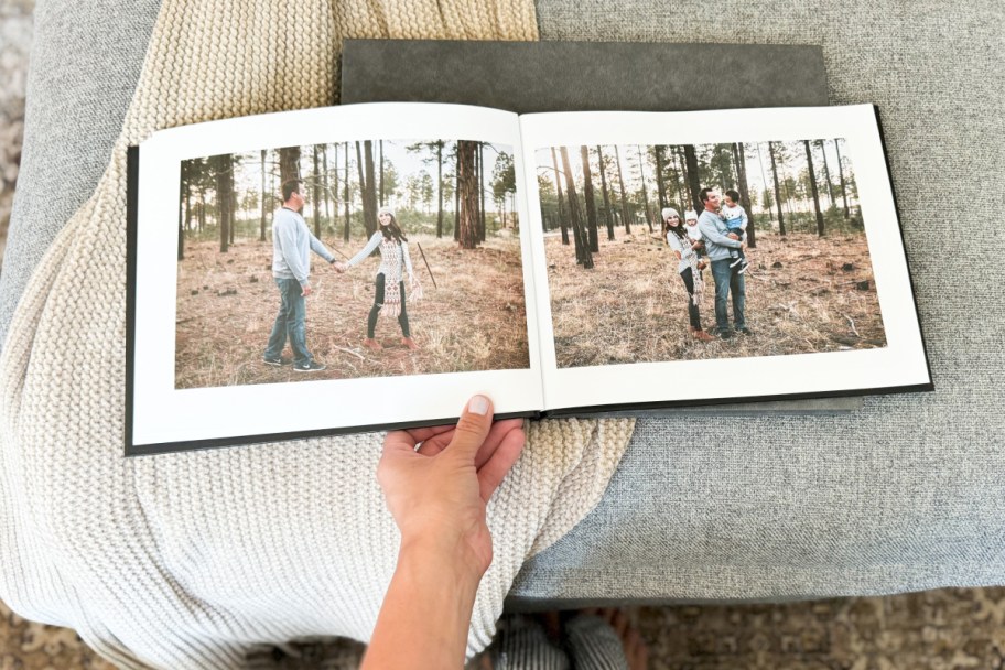 hand holding opened photo book