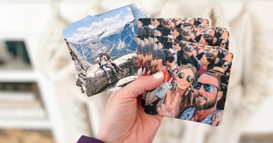 hand holding two sets of photo coasters 