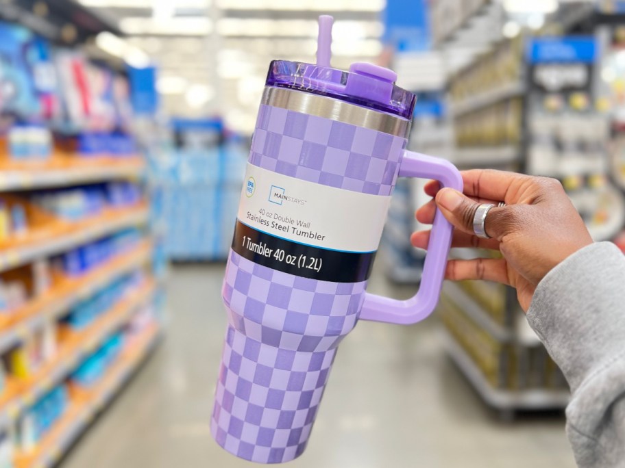 woman holding Mainstays 40 oz Stainless Steel Tumbler in Checkered Print in Purple