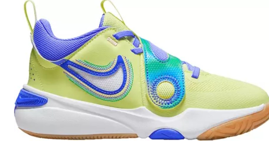 yellow, blue, and teal kids Nike shoe