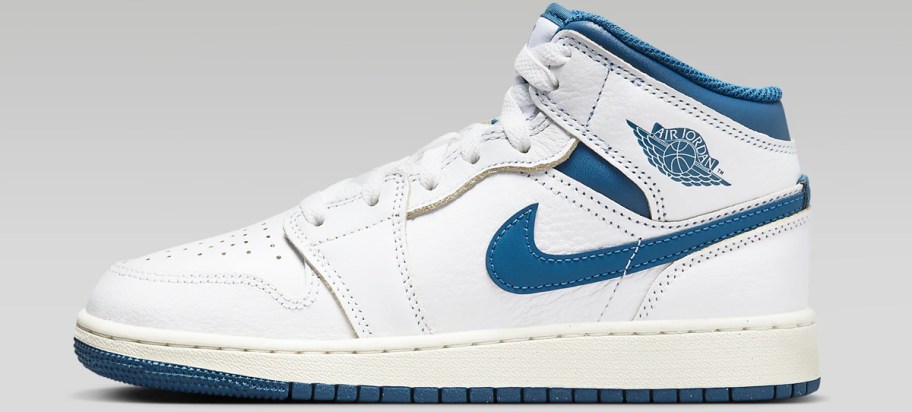 white and blue air jordan sneaker