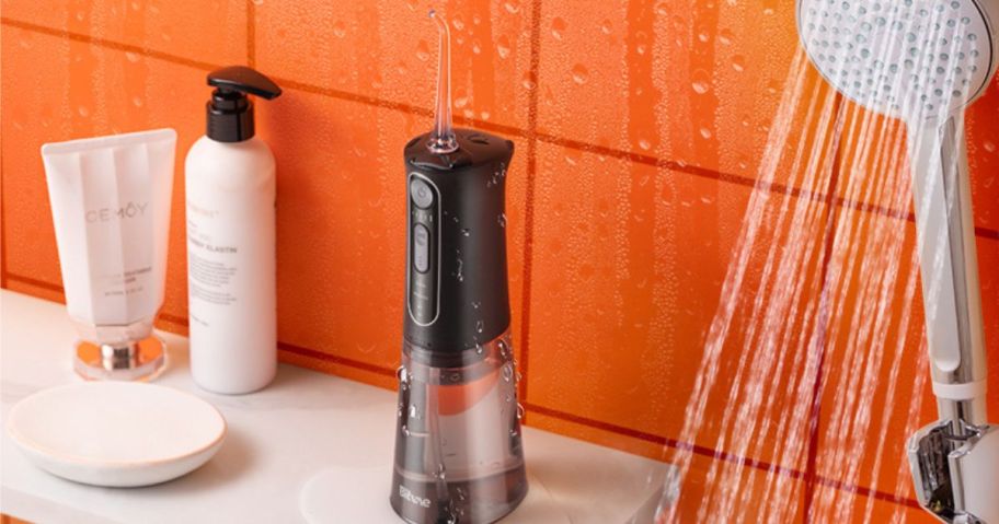 A Bitvae Water Flosser on a bathroom counter