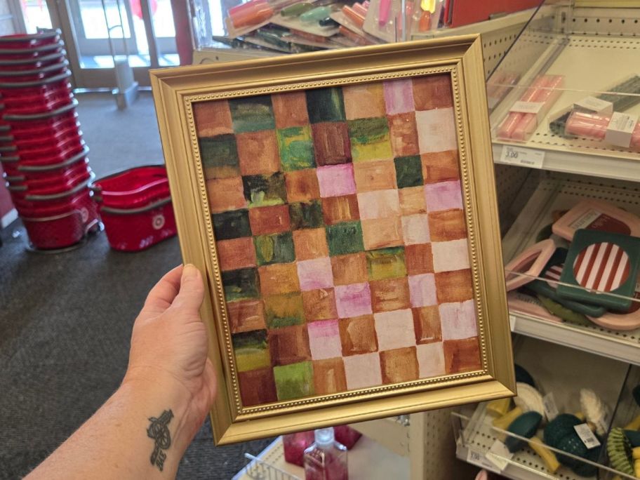 Checkered Wall Decor in hand in store