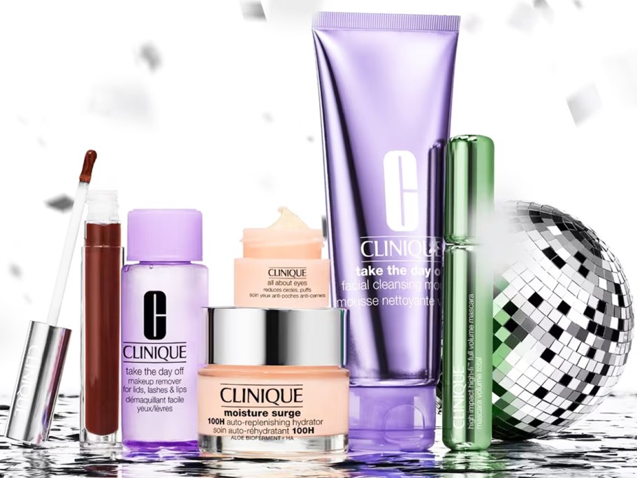 clinique makeup and skincare products display near a disco ball