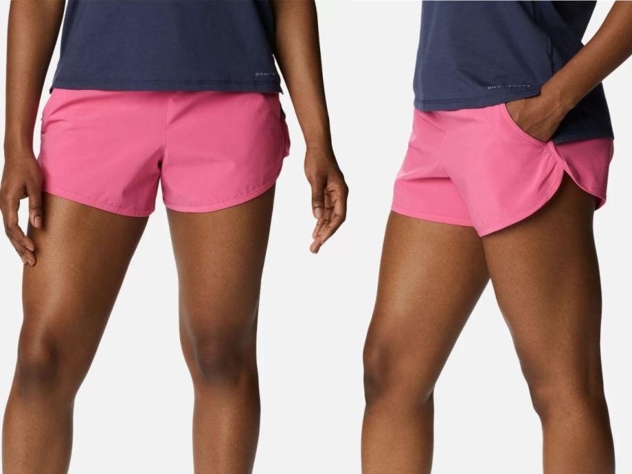 A woman wearing Columbia Women's Bogata Bay Stretch Shorts in Pink