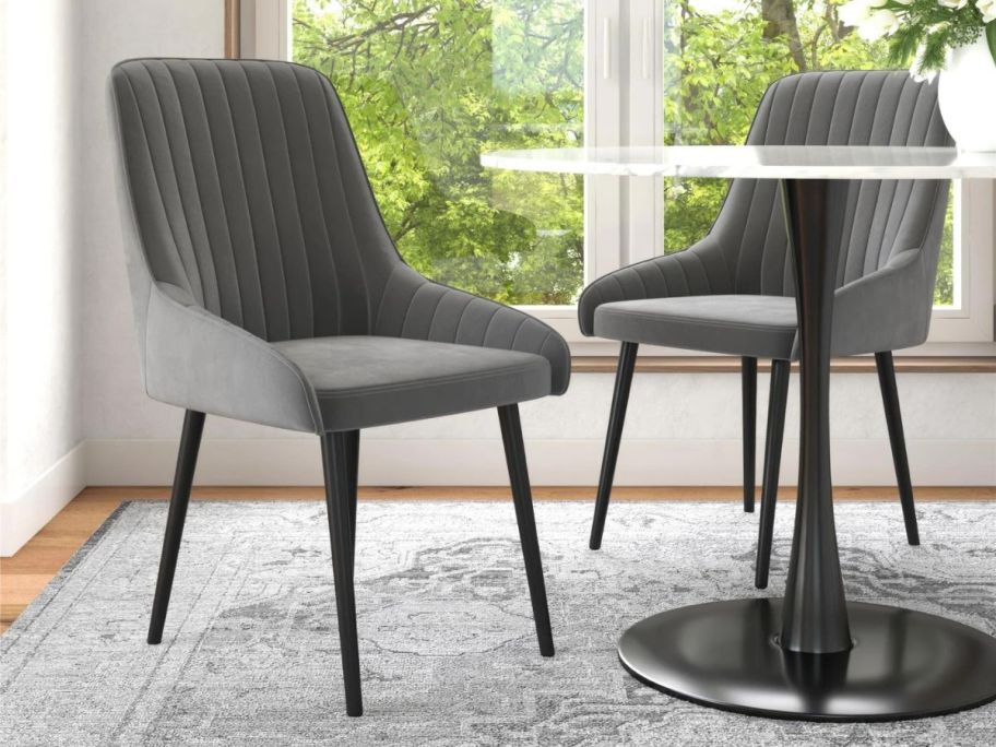 2 grey chairs at a table