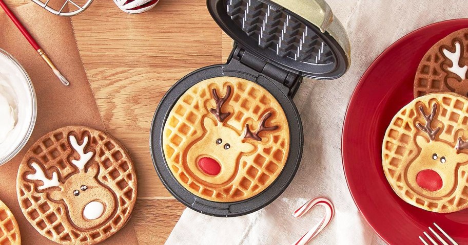 reindeer mini waffle sitting on waffle maker surrounded by more waffles