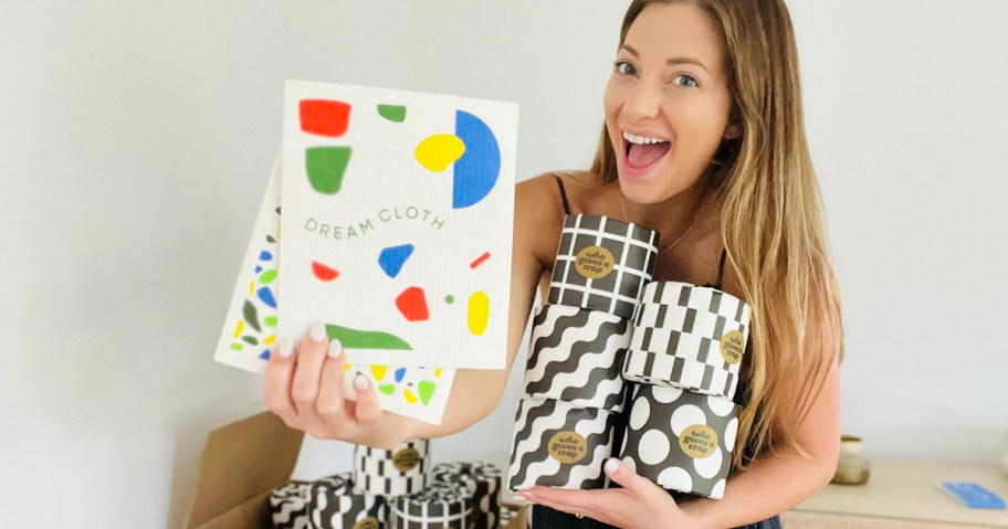 Woman holding swedish dish cloths and toilet paper