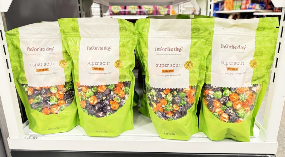 green bags of colorful popcorn on store shelf