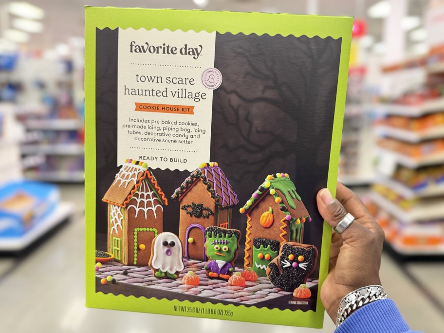 hand holding a Favorite Day Halloween Town Scare Haunted Village Cookie House Kit in store