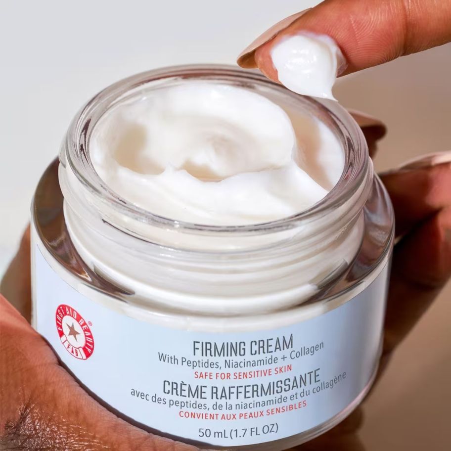 a jar of first aid beauty firming cream