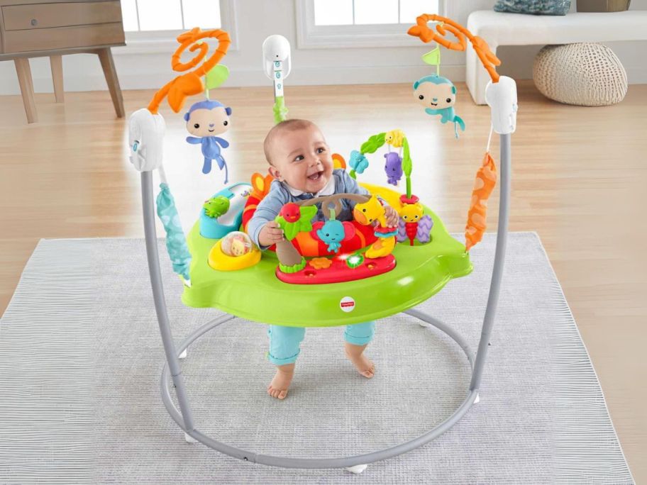 baby in Fisher-Price Baby Bouncer Tiger Time Jumperoo Activity Center