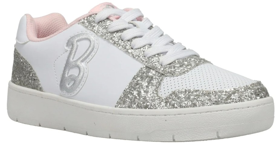 women's white and silver glitter low top sneaker with "B" Barbie logo