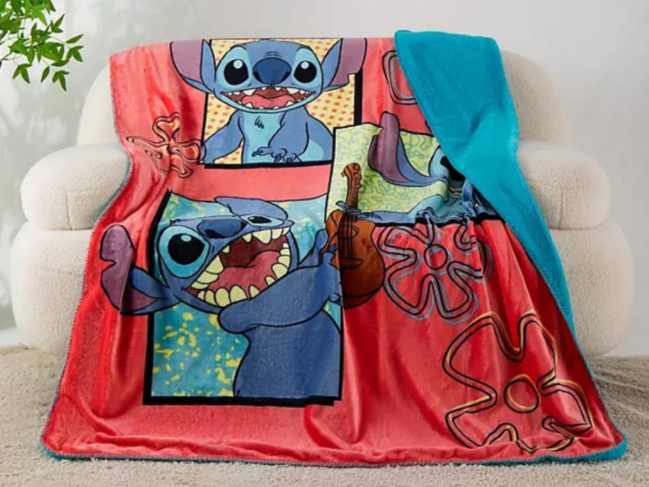 a red and blue Disney Stitch large throw blanket on a couch