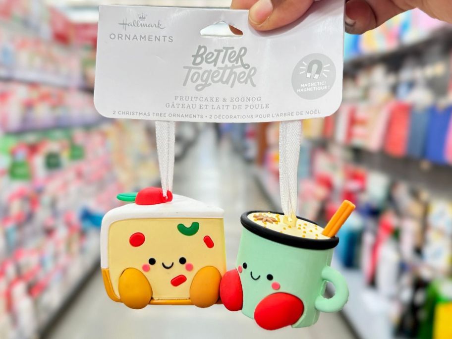 Hallmark Fruitcake & Eggnog Magnetic Ornament Duos in hand in store