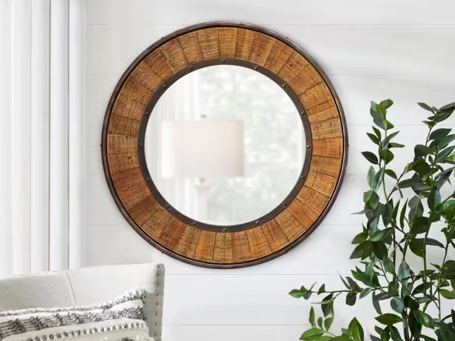 round wood framed wall mirror