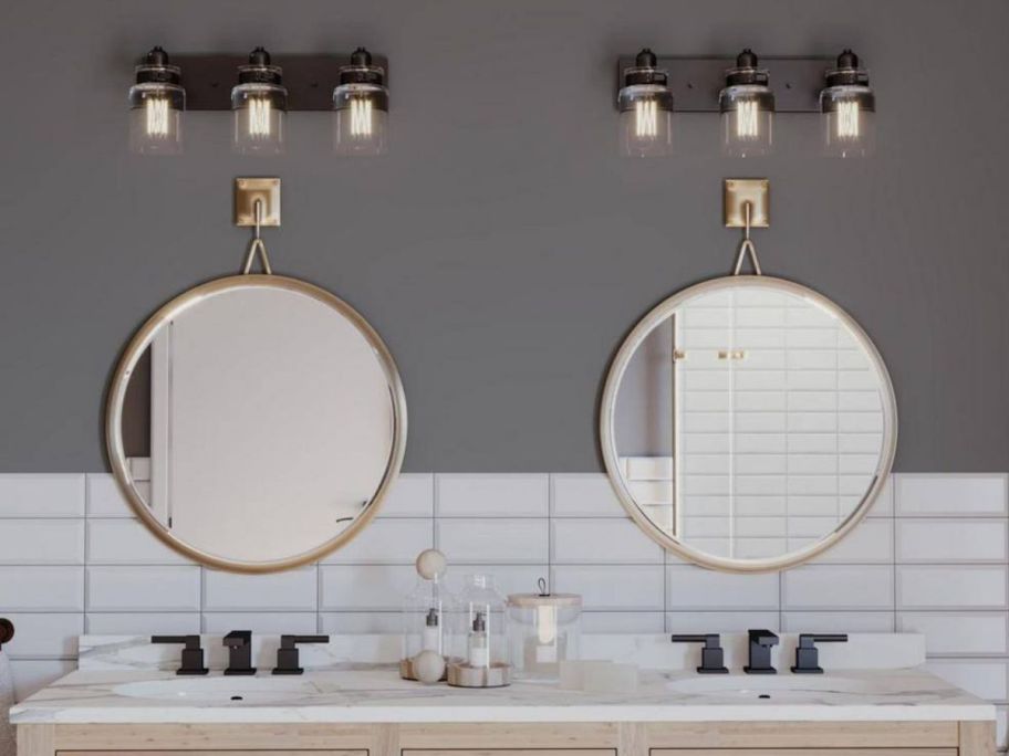 Dual bathroom mirrors with Progress Lighting Calhoun Collection 3-Light Vanity Lights above each one