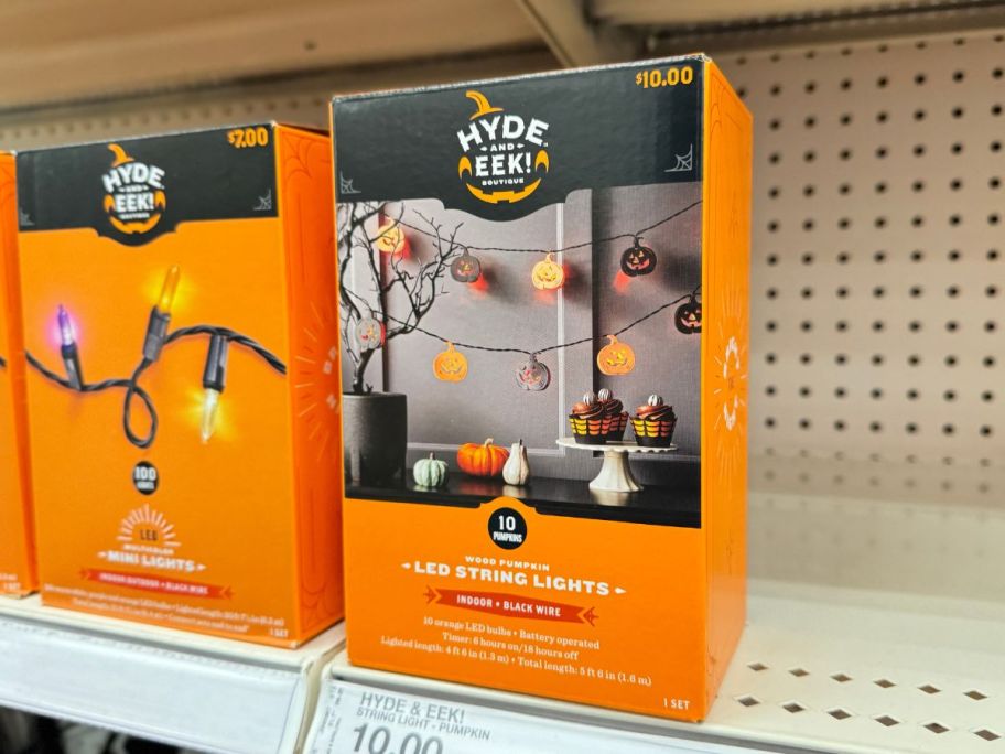 Hyde & EEK! Boutique 10-Count LED Wood Pumpkin Halloween String Lights on shelf in store