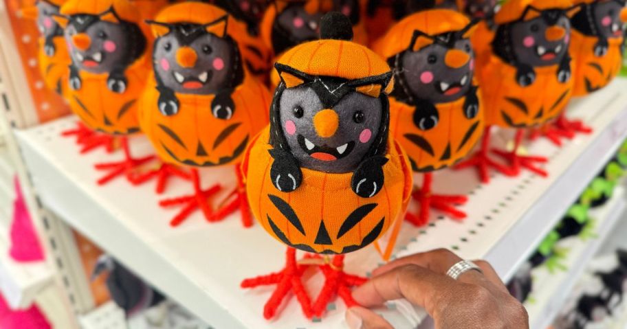 A shelf-full of Halloween-themed decorative birds at Target