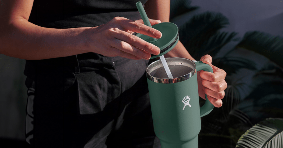 woman holding a Hydro Flask tumbler