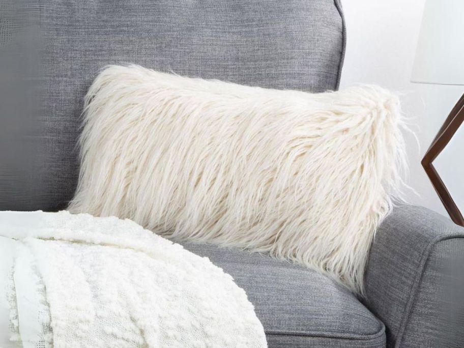 Ivory 12in x 20in Faux Mongolian Fur Decorative Lumbar Throw Pillow on couch