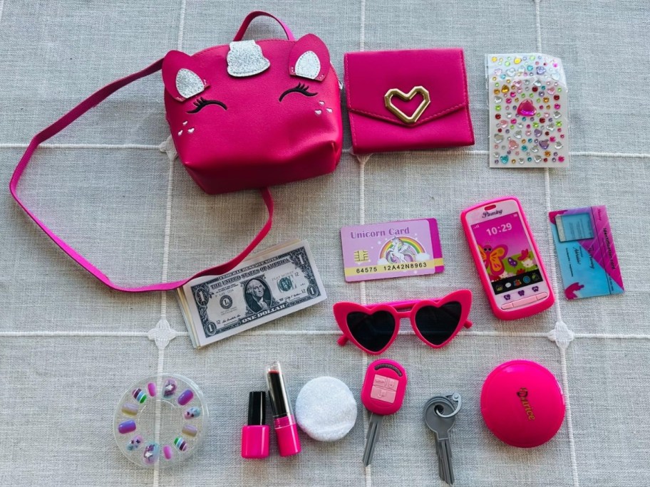 kids play set with purse and makeup accessories laid out
